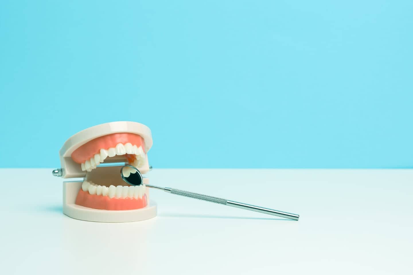 Dental mouth prop with a mirror, depicting a dental checkup in Karachi at Dr Arshad's Dental Care (clinic).